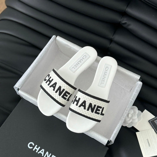CHANEL Woven Embroidered Letter Slippers White Black