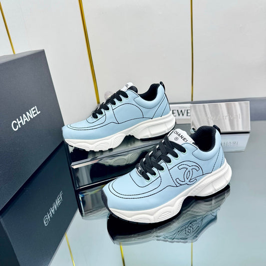 CHANEL TRAINERS SNEAKER IN LIGHT BLUE CALFSKIN WITH BLACK EMBROIDERED